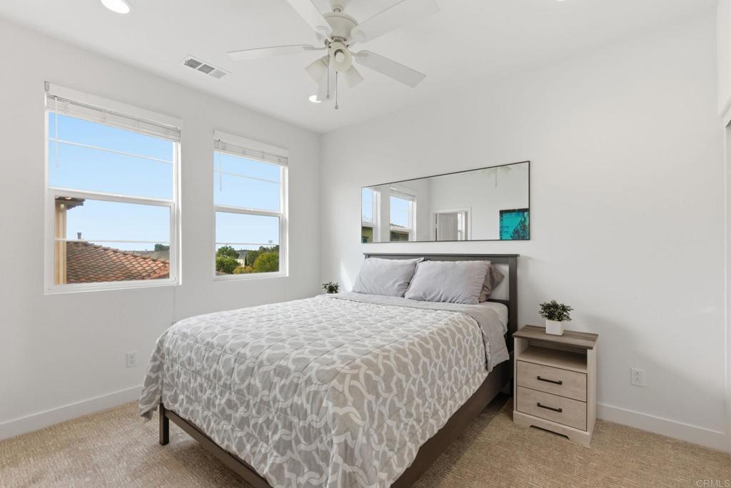 4367 Pacifica Way, Unit 2 Oceanside, CA 92056 - Photo 19 of 37 a bedroom with a bed and a window