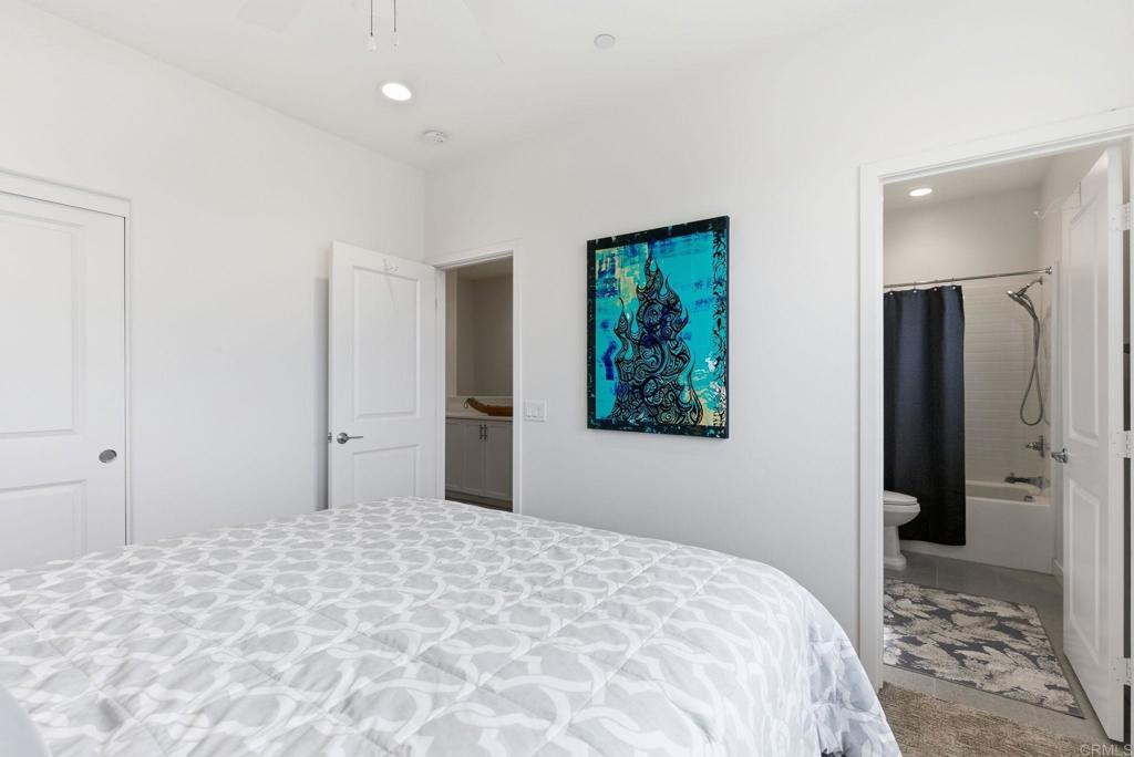4367 Pacifica Way, Unit 2 Oceanside, CA 92056 - Photo 20 of 37 a bedroom with a bed and a window