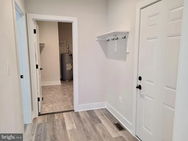 a view of a backyard with swimming pool and furniture