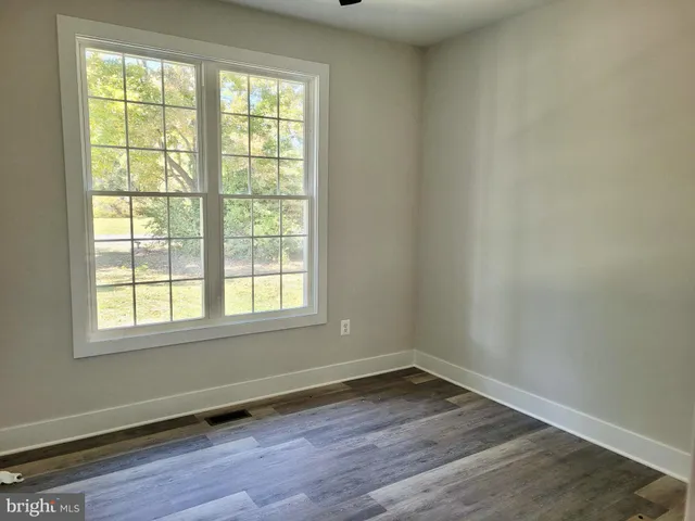 a view of outdoor space with garden and trees