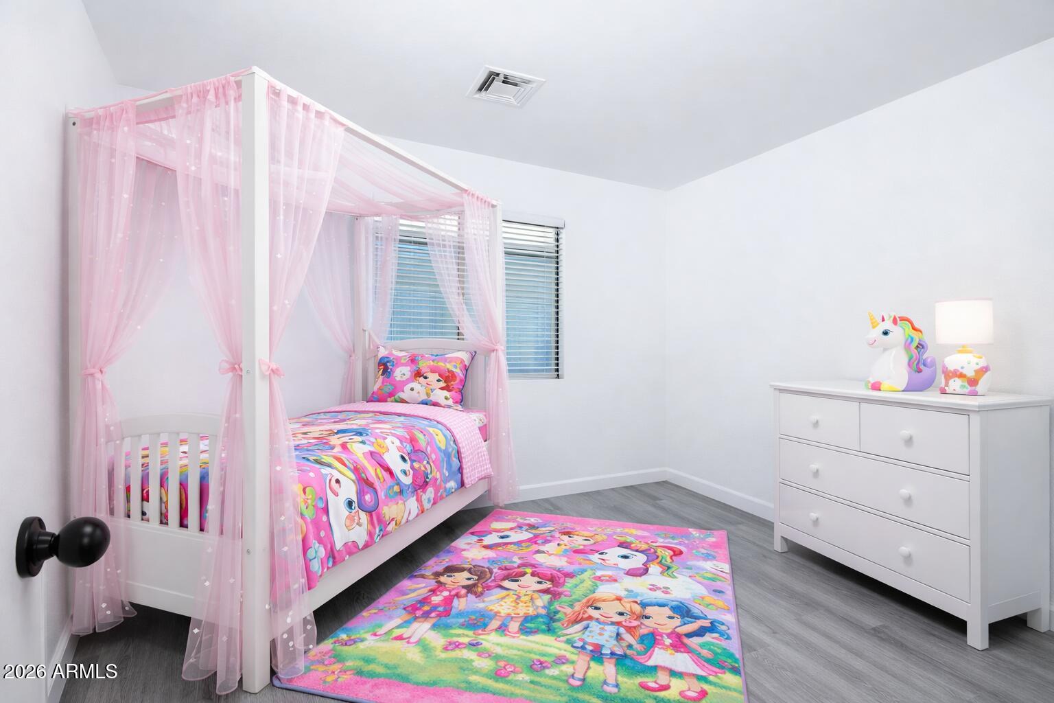 450 South Crismon Road Mesa, AZ 85208 - Photo 9 of 12 a bedroom with a bed and a dresser