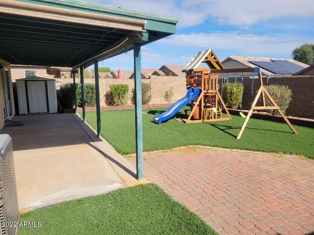 a view of backyard with small cabin