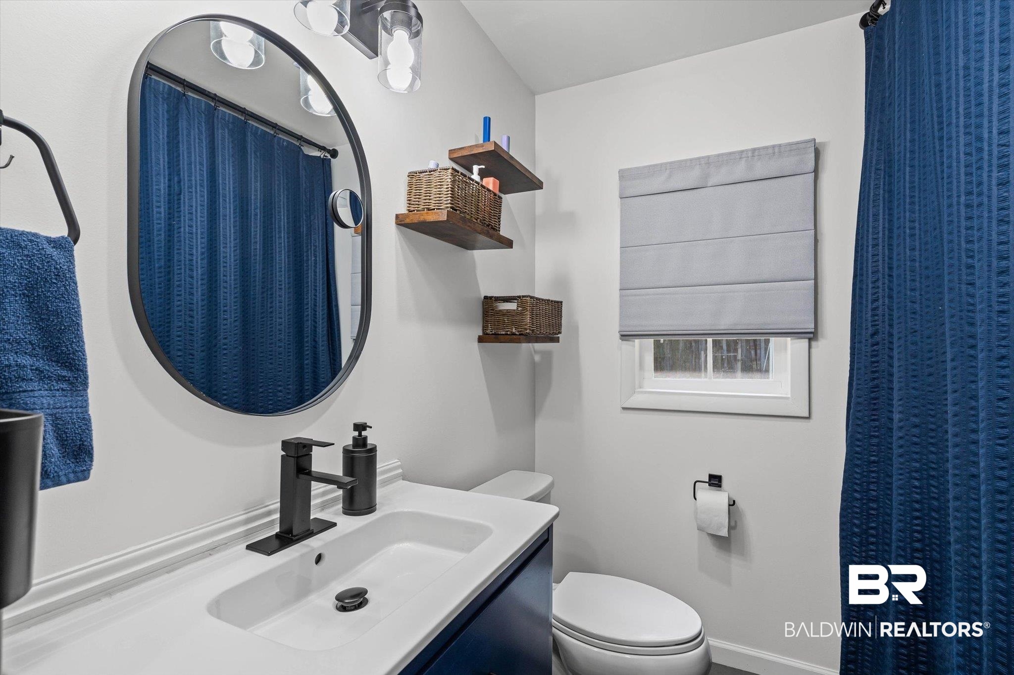 5609 Diane Court Mobile, AL 36618 - Photo 15 of 22 Bathroom with vanity and a shower with curtain