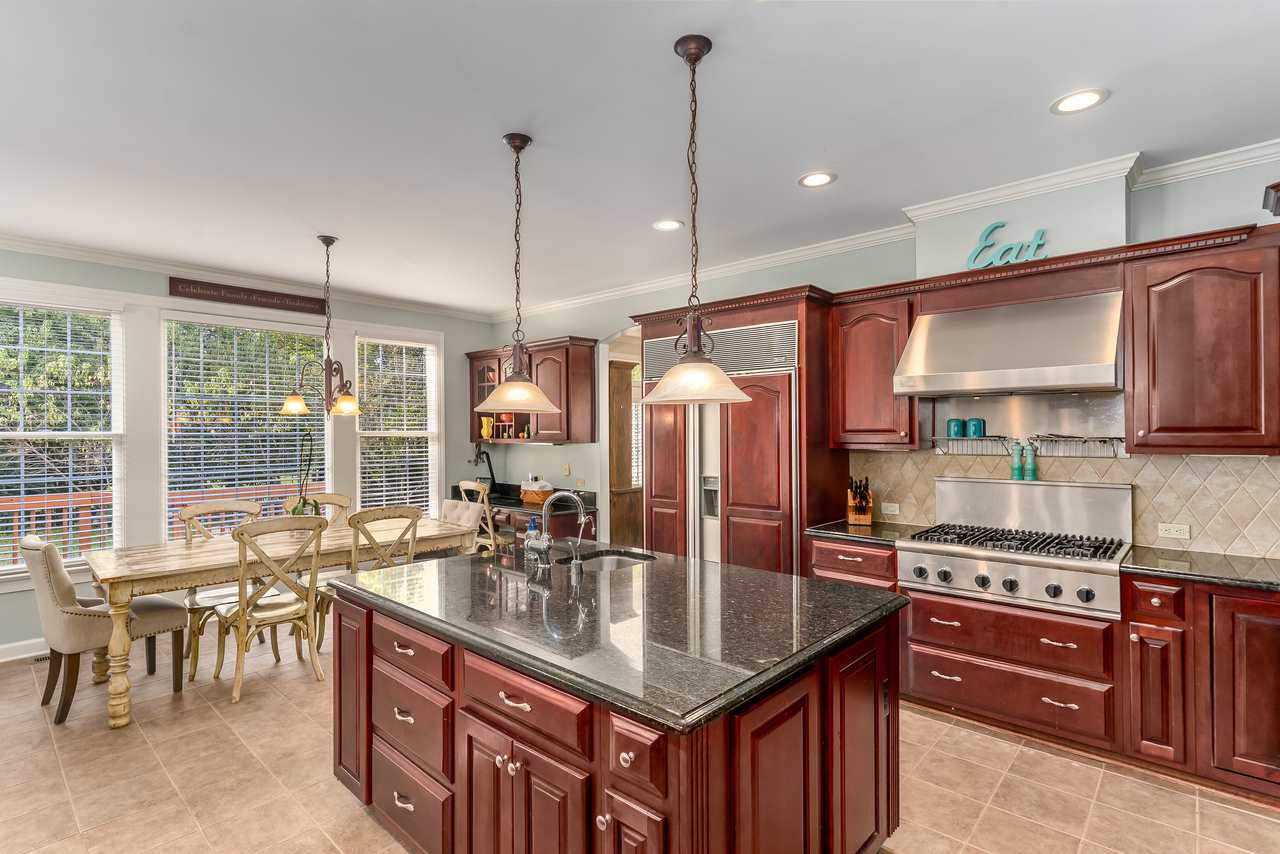 12419 Canolder Street Raleigh, NC 27614 - Photo 8 of 29 Gourmet kitchen with instant hot water, Thermidor six buyer stovetop, double oven...makes cooking for one or twenty a breeze. Kitchen