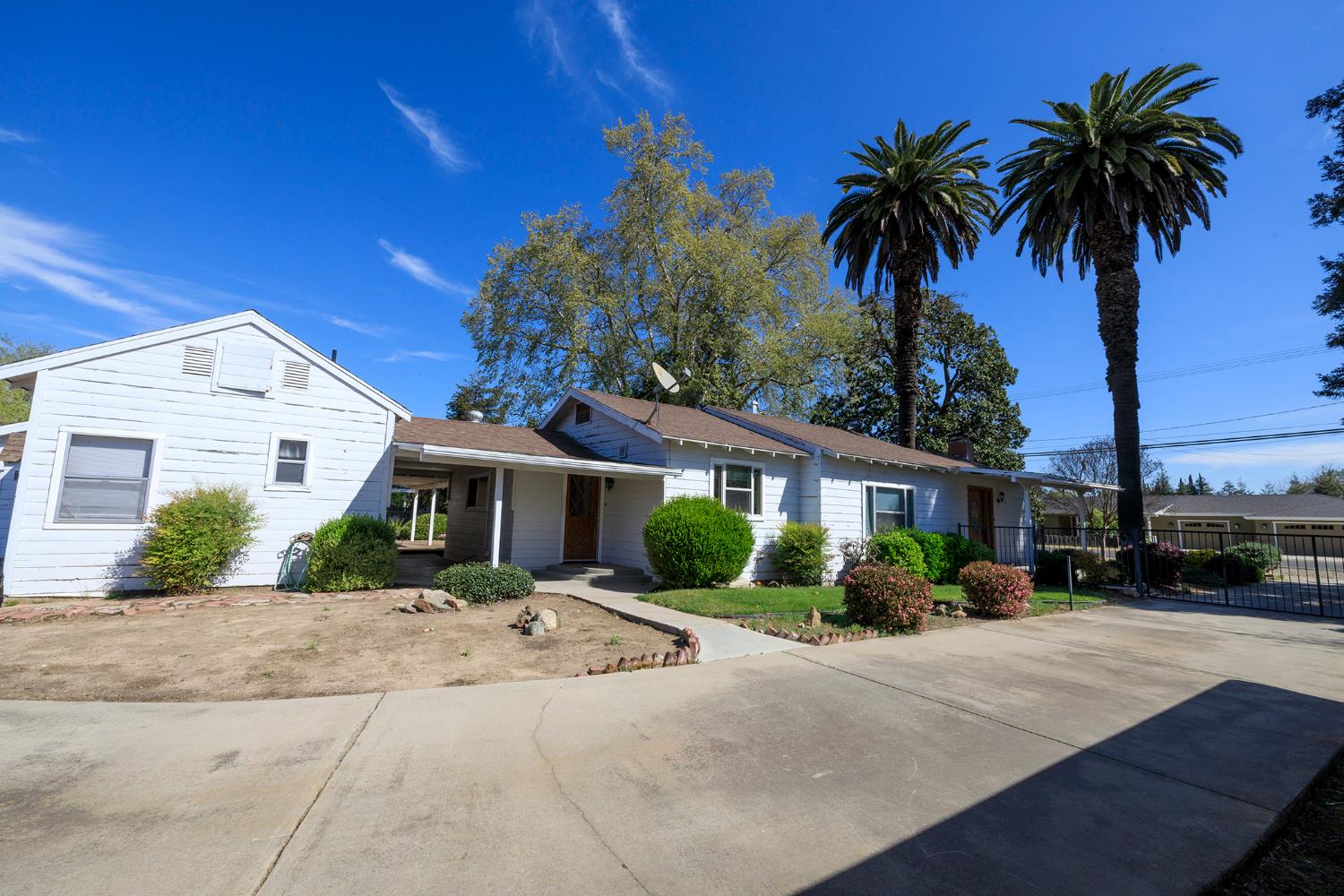 4541 North Gratton Road Denair, CA 95316 - Photo 11 of 75 a front view of a house with garden and trees