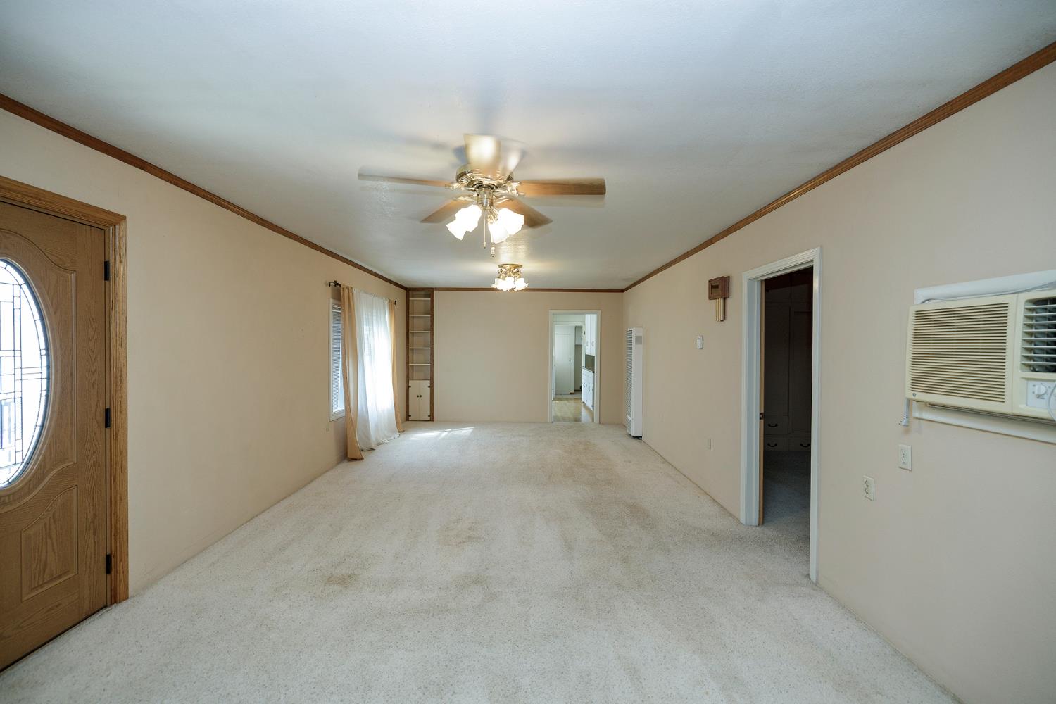 4541 North Gratton Road Denair, CA 95316 - Photo 20 of 75 a view of a livingroom with a chandelier fan and windows