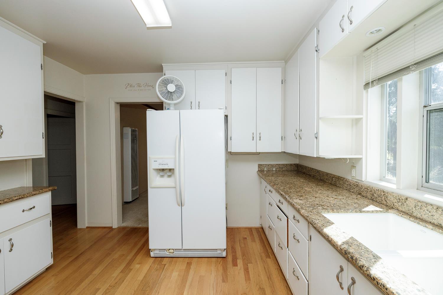 4541 North Gratton Road Denair, CA 95316 - Photo 27 of 75 a kitchen with granite countertop a refrigerator and a sink