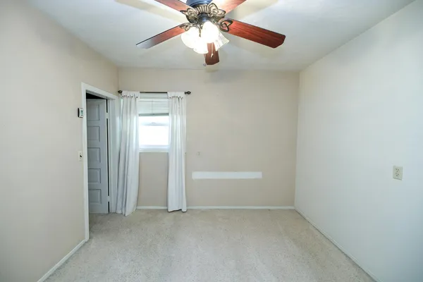 a view of a porch with wooden floor
