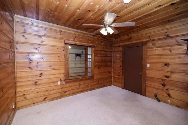 a view of room with window and wooden floor