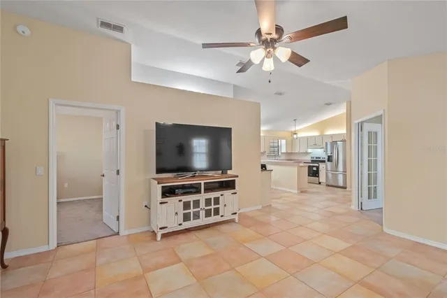 a view of a livingroom with furniture and a flat screen tv