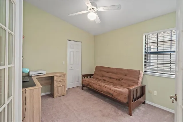 a living room with furniture and a window