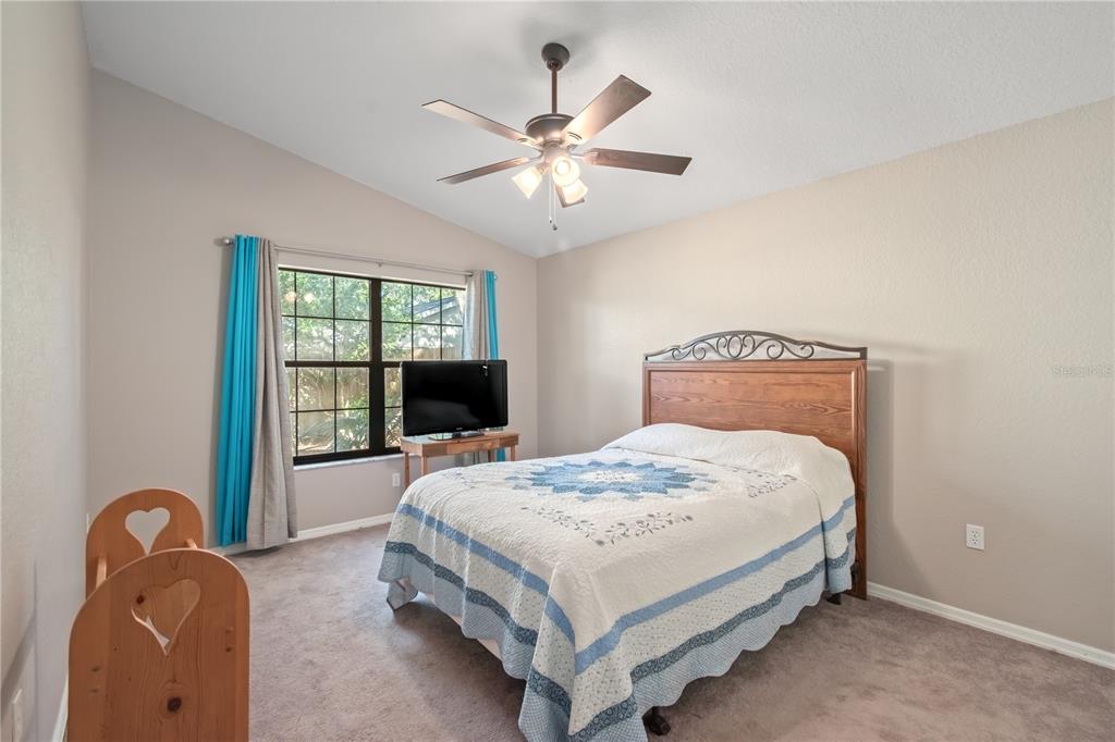 3911 Northeast 22nd Street Ocala, FL 34470 - Photo 20 of 46 a bedroom with a bed and a window