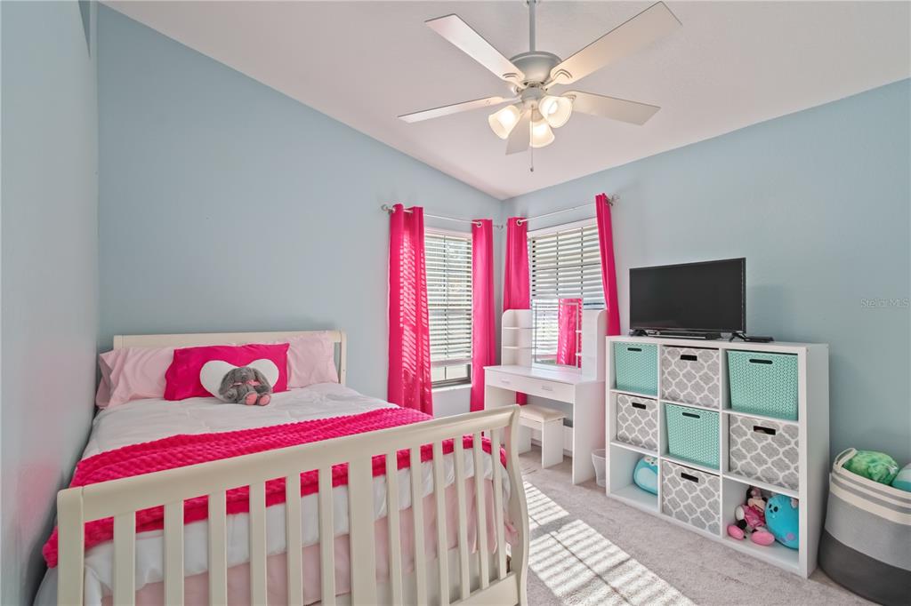 3911 Northeast 22nd Street Ocala, FL 34470 - Photo 27 of 46 a bedroom with furniture and a flat screen tv