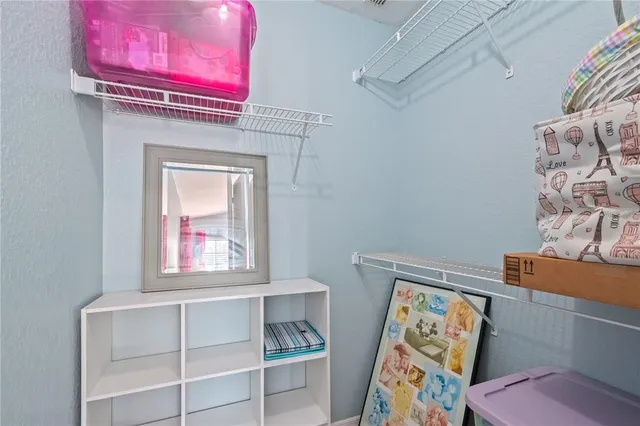 a bathroom with a double vanity sink a mirror and a shower