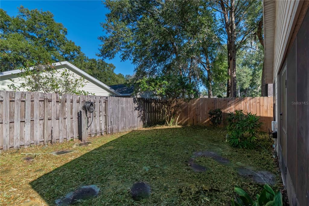3911 Northeast 22nd Street Ocala, FL 34470 - Photo 39 of 46 a backyard of a house with lots of green space