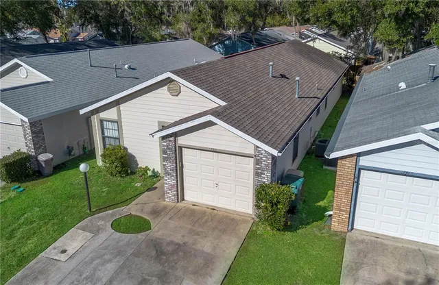 an aerial view of residential houses with outdoor space