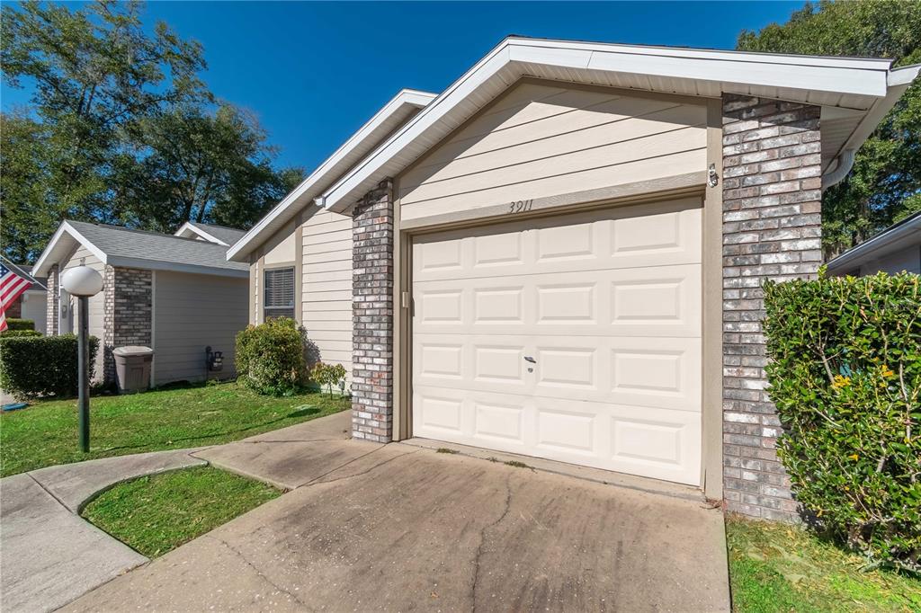 3911 Northeast 22nd Street Ocala, FL 34470 - Photo 6 of 46 a view of a house with a yard