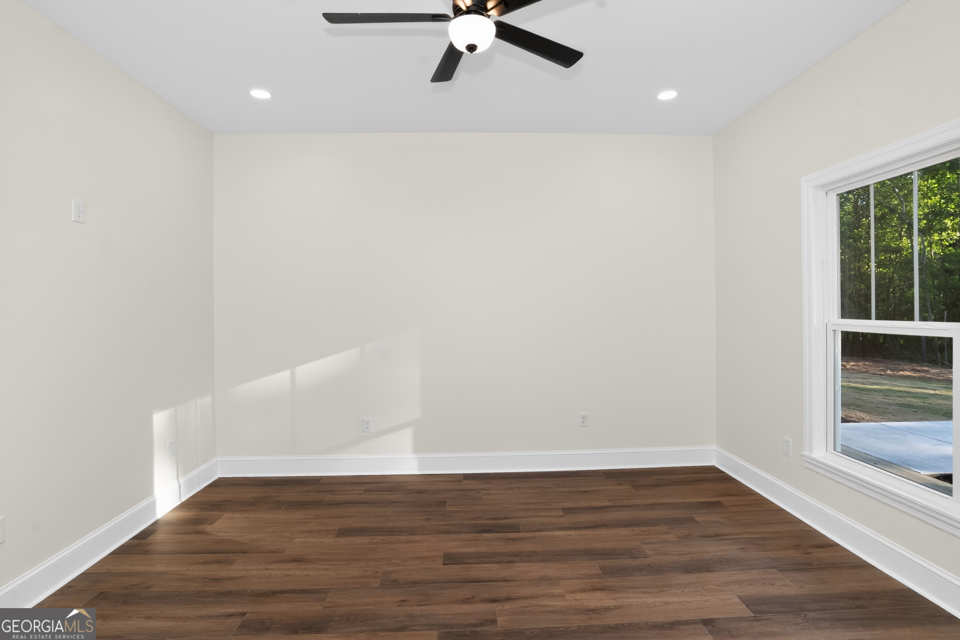 166 Midway Road Barnesville, GA 30204 - Photo 33 of 62 a view of an empty room with wooden floor and a window