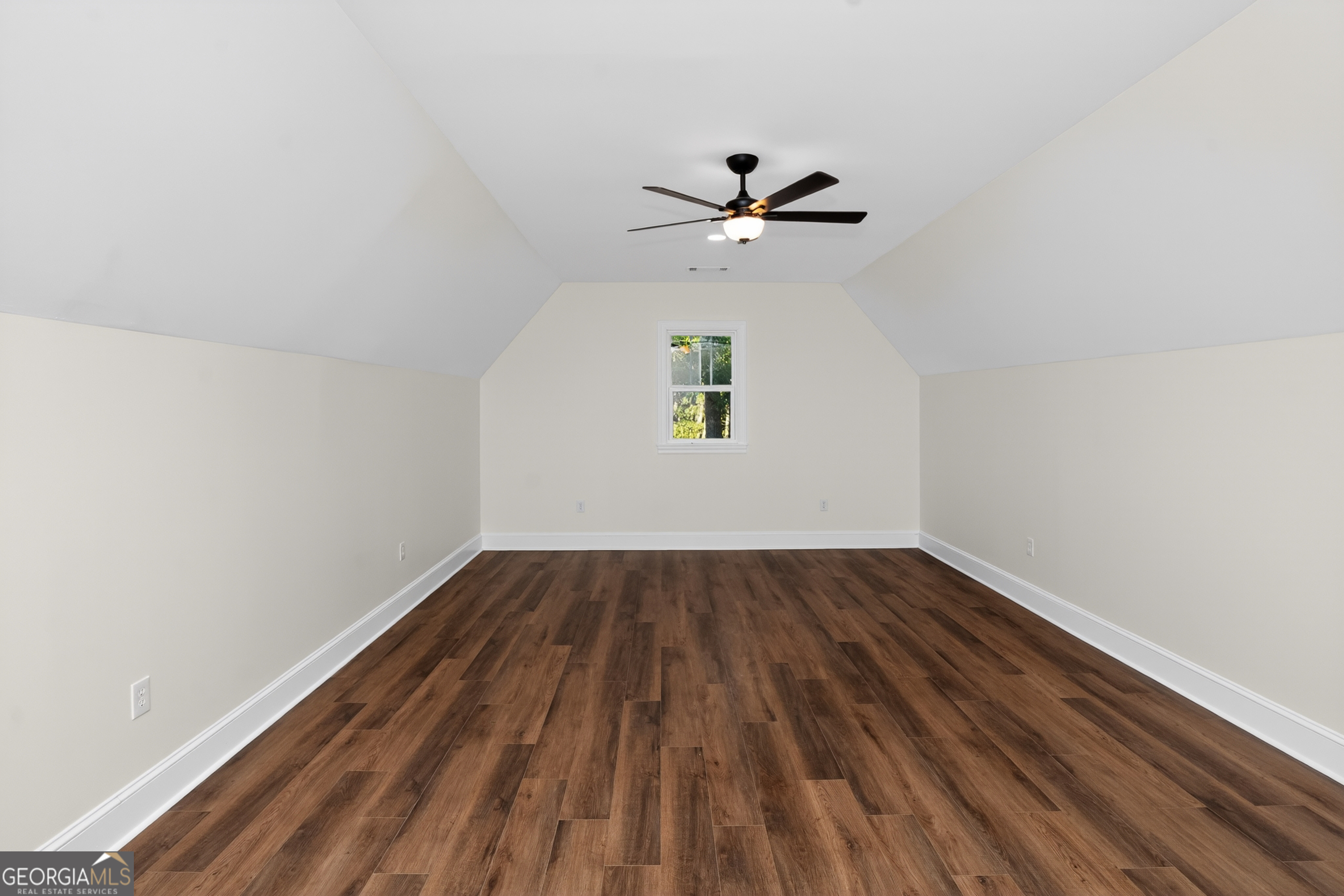 166 Midway Road Barnesville, GA 30204 - Photo 46 of 62 a view of empty room with wooden floor and fan
