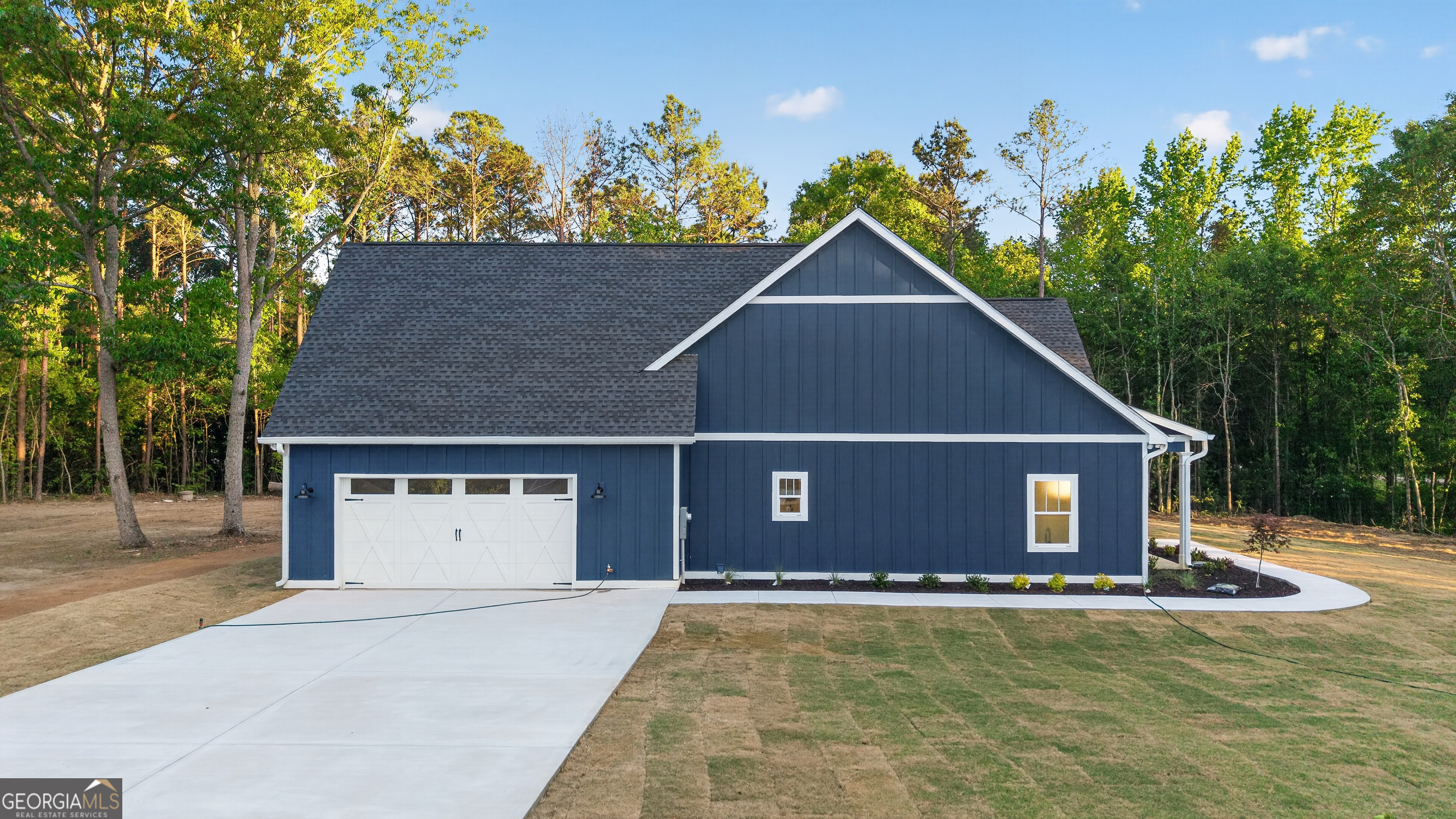 166 Midway Road Barnesville, GA 30204 - Photo 50 of 62 a view of a house with a yard and a garage