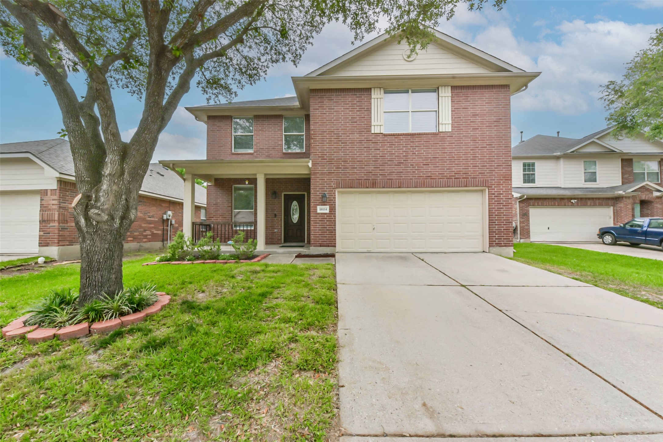 10114 Sand Tracks Court Houston, TX 77064 - Photo 14 of 49 a front view of a house with a yard and garage