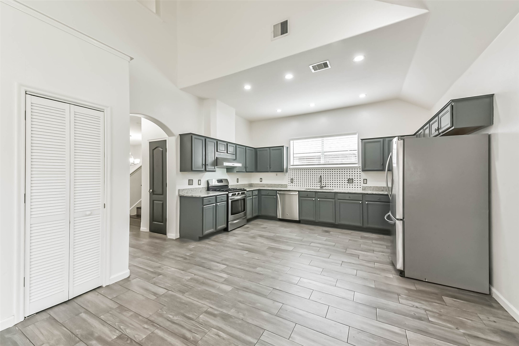 10114 Sand Tracks Court Houston, TX 77064 - Photo 21 of 49 a kitchen with stainless steel appliances a sink and a refrigerator