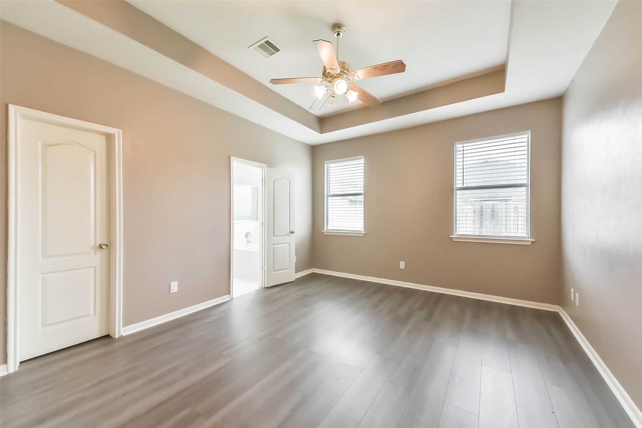 10114 Sand Tracks Court Houston, TX 77064 - Photo 23 of 49 a view of an empty room with wooden floor and a window
