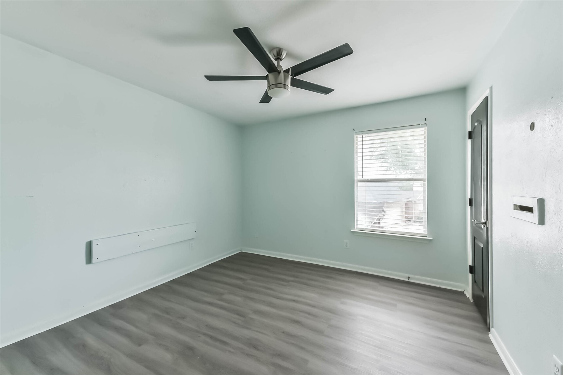 10114 Sand Tracks Court Houston, TX 77064 - Photo 33 of 49 wooden floor in an empty room with a window