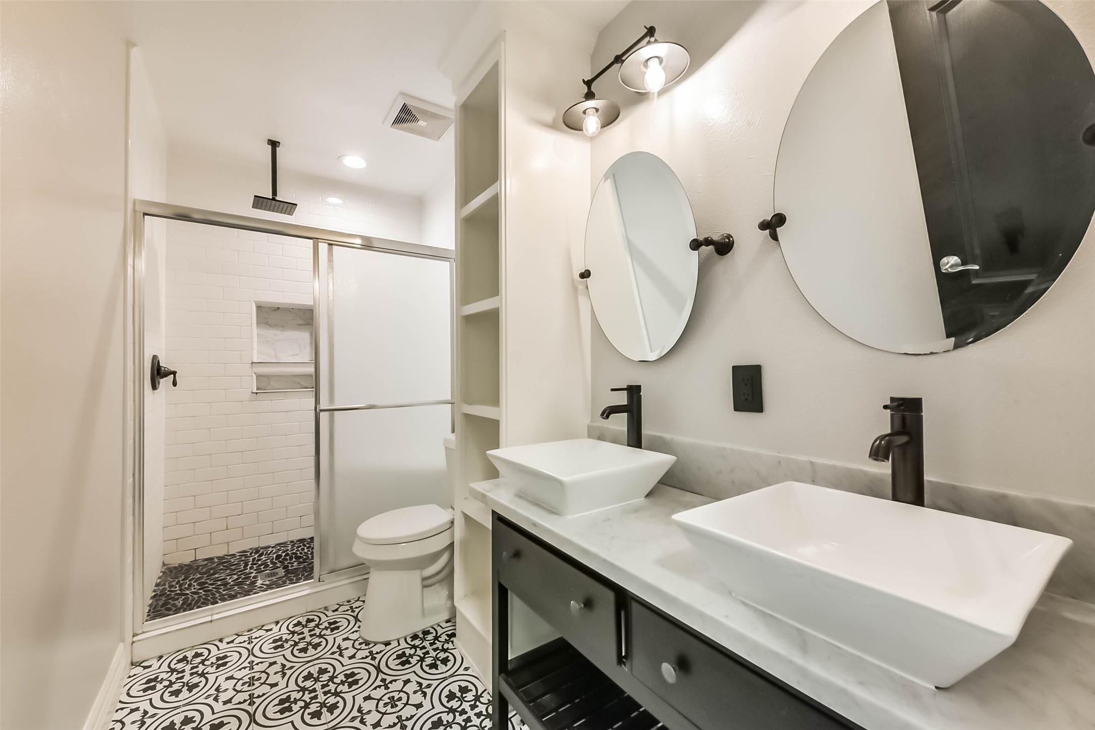 10114 Sand Tracks Court Houston, TX 77064 - Photo 39 of 49 a bathroom with a double vanity sink toilet and shower