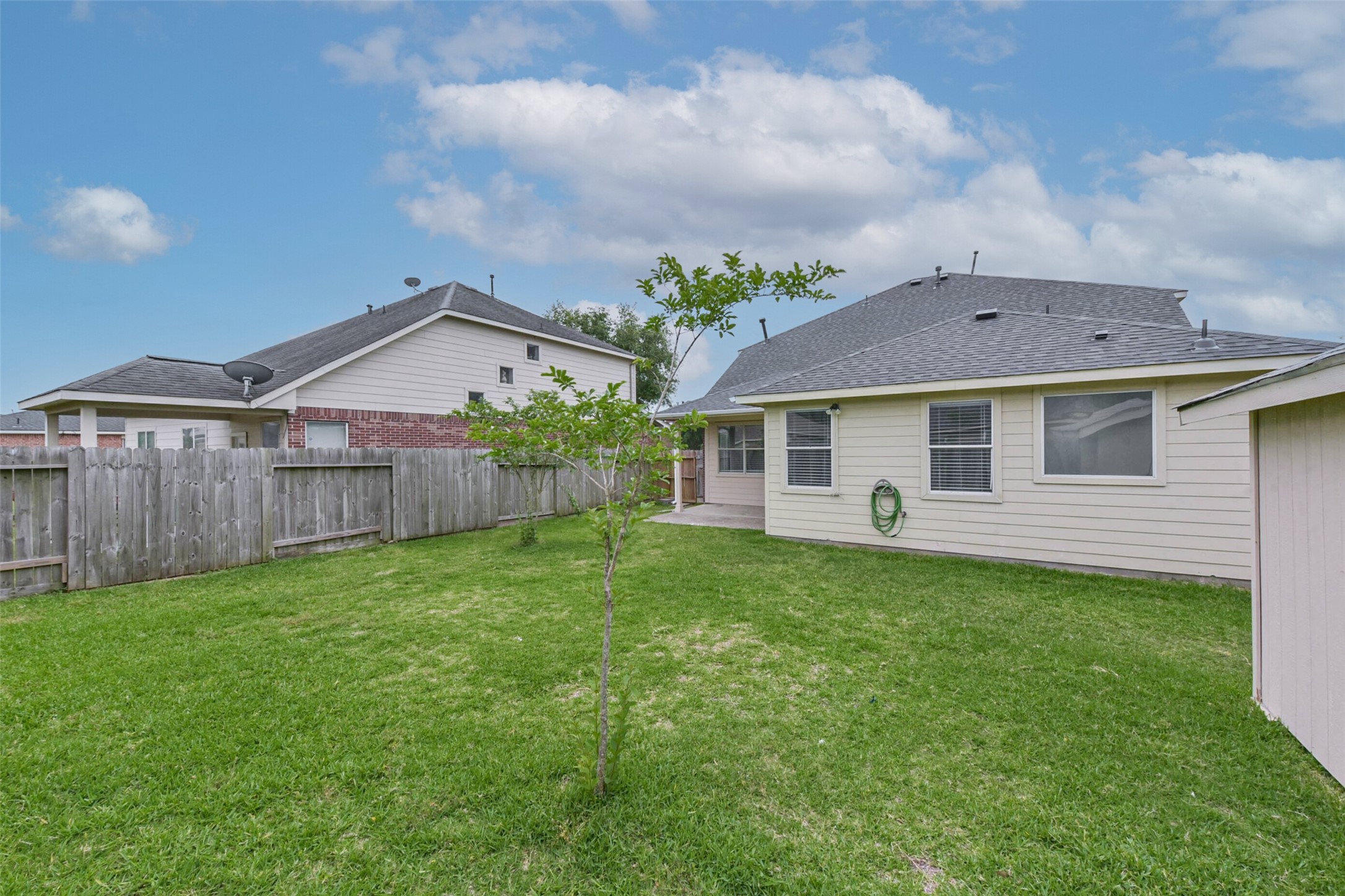 10114 Sand Tracks Court Houston, TX 77064 - Photo 41 of 49 a front view of a house with garden