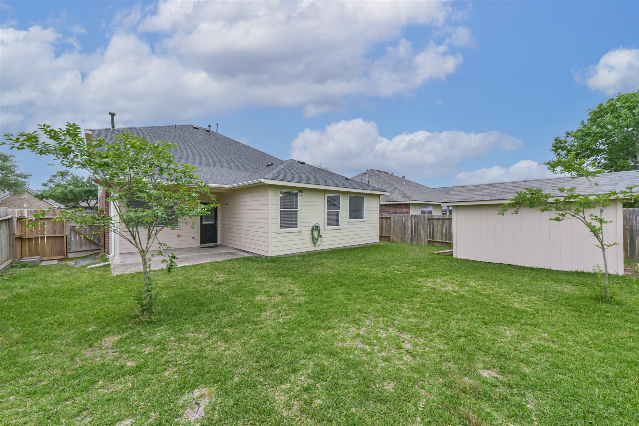 10114 Sand Tracks Court Houston, TX 77064 - Photo 42 of 49 a view of a backyard with a garden and entertaining space