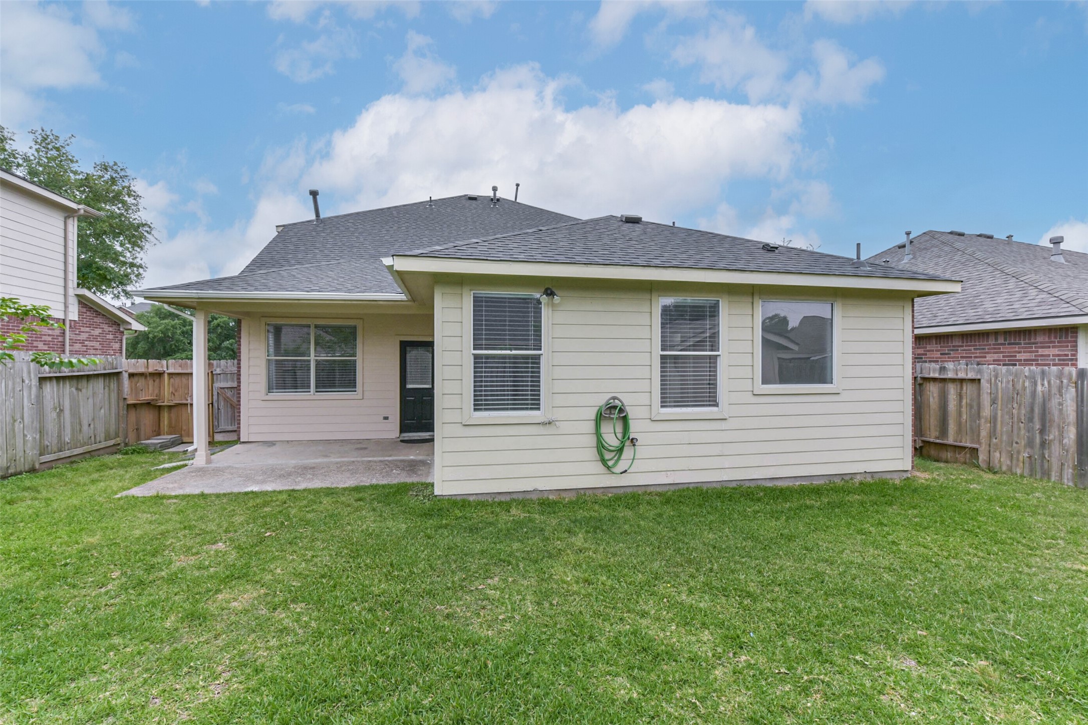10114 Sand Tracks Court Houston, TX 77064 - Photo 43 of 49 a front view of a house with a yard and garage