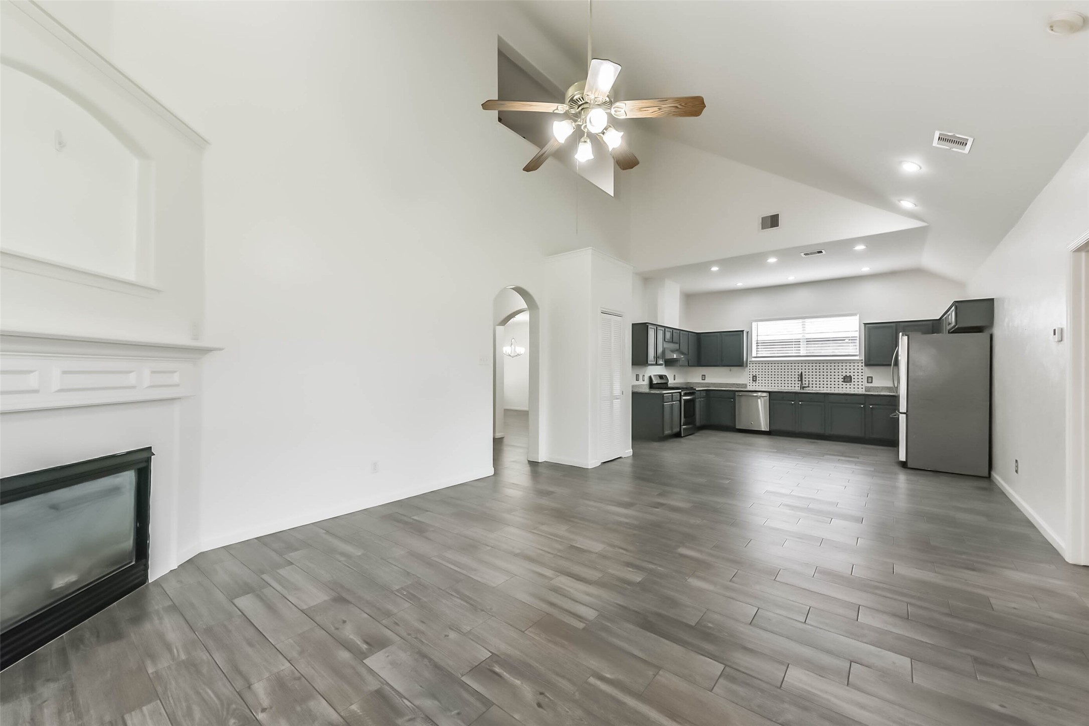 10114 Sand Tracks Court Houston, TX 77064 - Photo 7 of 49 a view of a kitchen with a sink cabinets and a kitchen