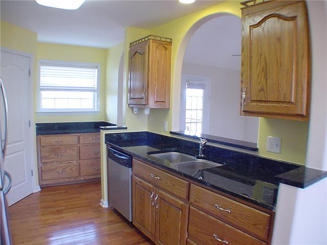 1923 Clara Mathis Road Spring Hill, TN 37174 - Photo 6 of 20 Kitchen view #2. Custom oak cabinets and granite counter top.