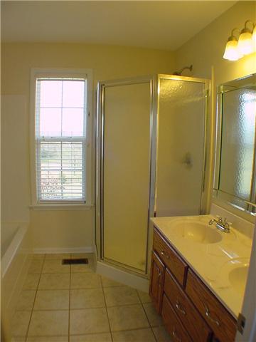 1923 Clara Mathis Road Spring Hill, TN 37174 - Photo 10 of 20 Master bath with tile floor, tub with separate shower. Double vanity with drawer storage.