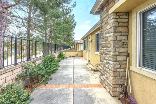a view of a house with a yard from a balcony