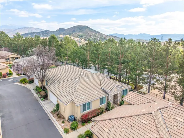 an aerial view of a house with yard