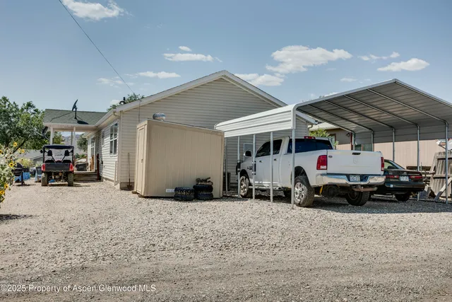 a front view of a house with outdoor seating