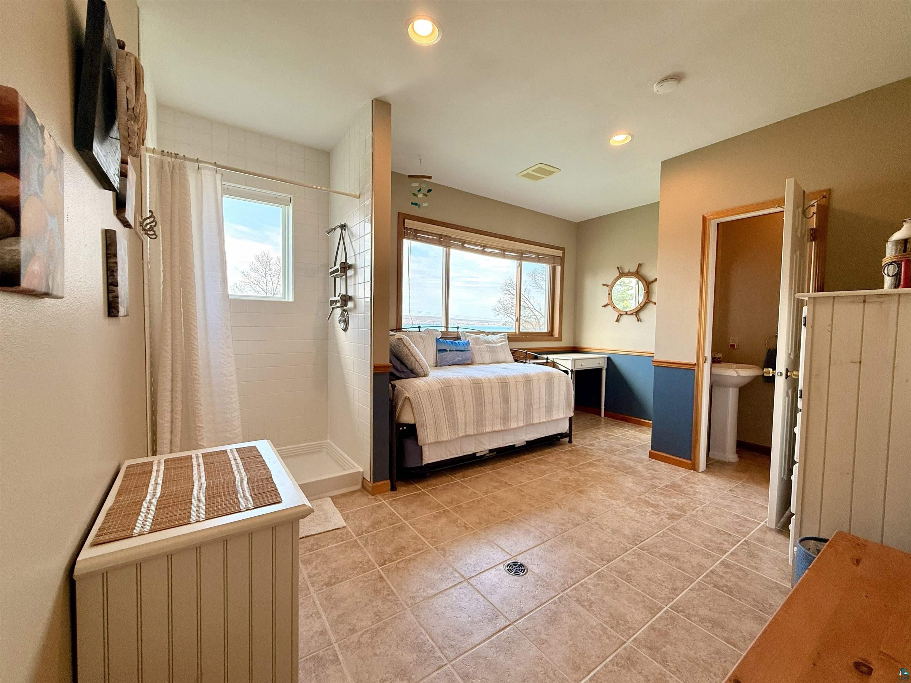 668 Fort Road, Unit 5 La Pointe, WI 54850 - Photo 14 of 27 3rd level loft complete with 3/4 bathroom