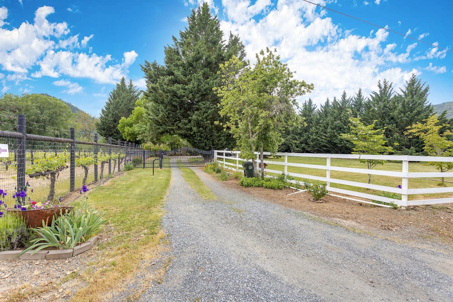 9155 North Applegate Road Grants Pass, OR 97527 - Photo 2 of 35 a view of a swimming pool with a patio and a yard