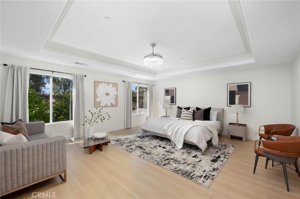 315 San Antonio Road Arcadia, CA 91007 - Photo 34 of 63 a spacious bedroom with a bed a couch and a window