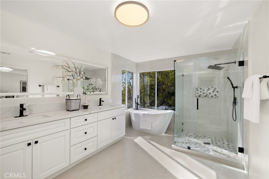 315 San Antonio Road Arcadia, CA 91007 - Photo 36 of 63 a bathroom with a granite countertop sink mirror and bathtub