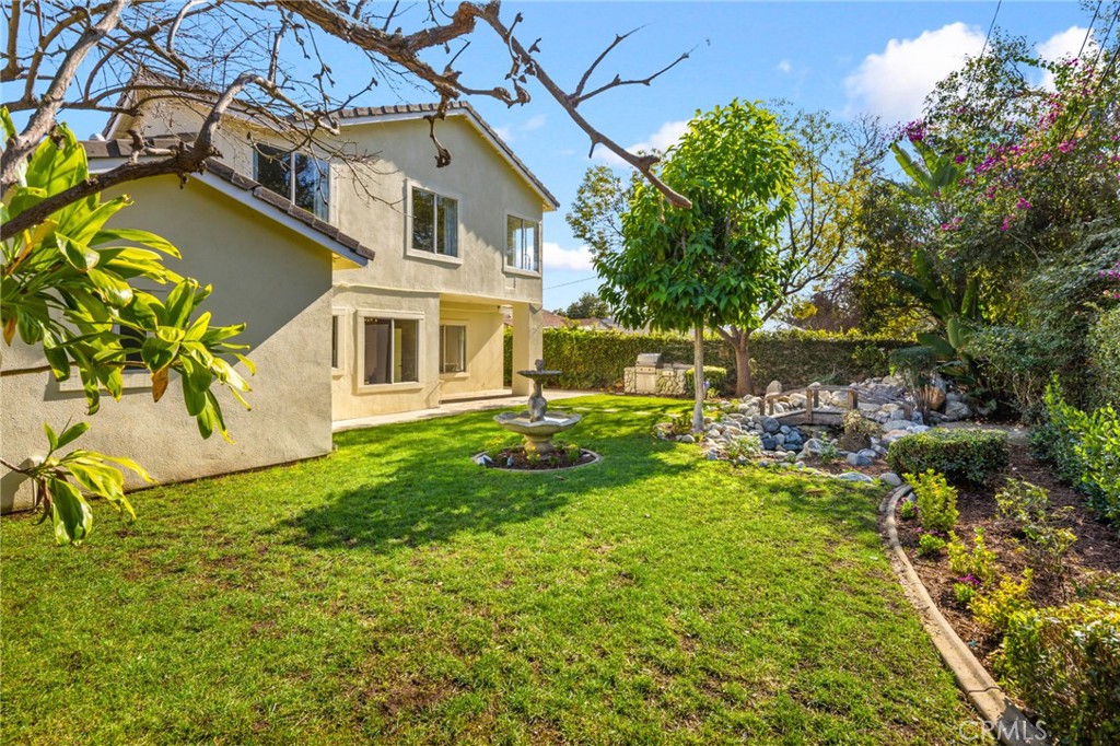 315 San Antonio Road Arcadia, CA 91007 - Photo 47 of 63 a view of a house with a big yard potted plants and large tree
