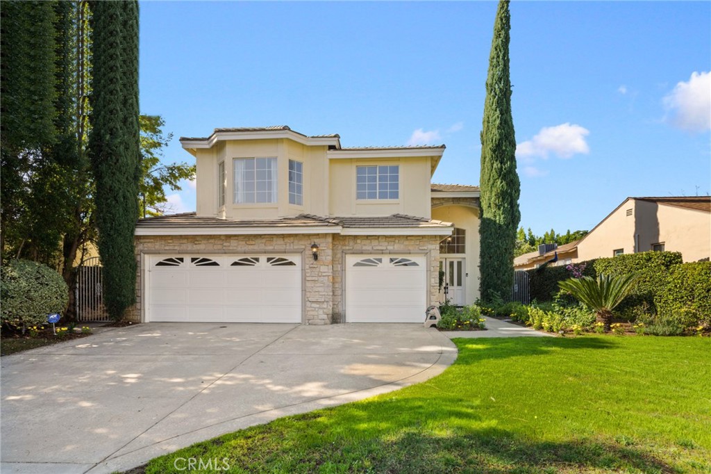 315 San Antonio Road Arcadia, CA 91007 - Photo 9 of 63 a view of a white house next to a yard with big trees