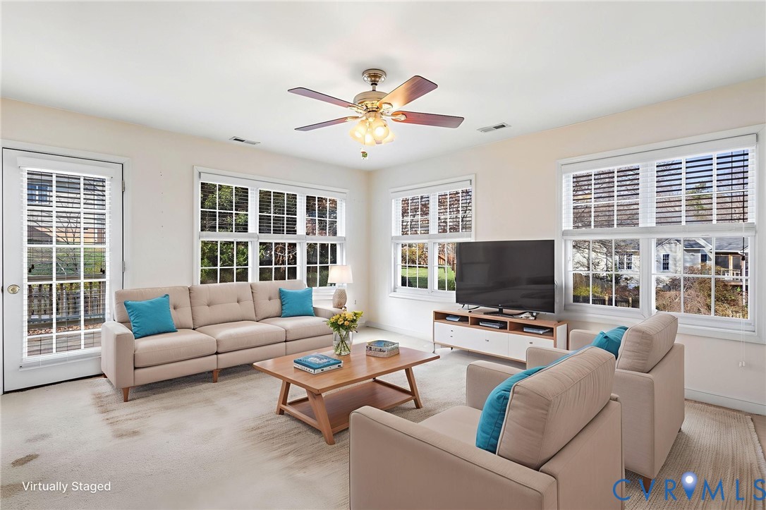 3120 Clintwood Road Midlothian, VA 23112 - Photo 15 of 38 a living room with furniture a fireplace and a flat screen tv