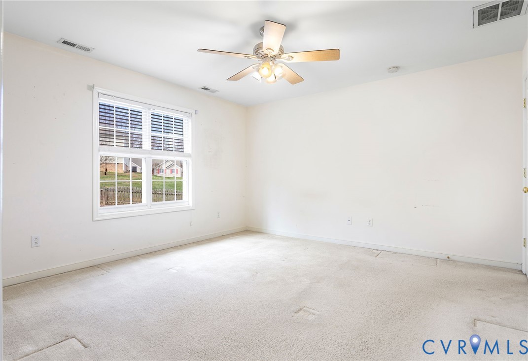 3120 Clintwood Road Midlothian, VA 23112 - Photo 20 of 38 an empty room with windows and fan