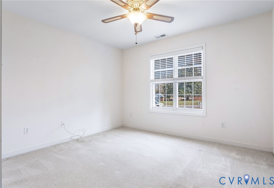 3120 Clintwood Road Midlothian, VA 23112 - Photo 23 of 38 an empty room with a window and a ceiling fan