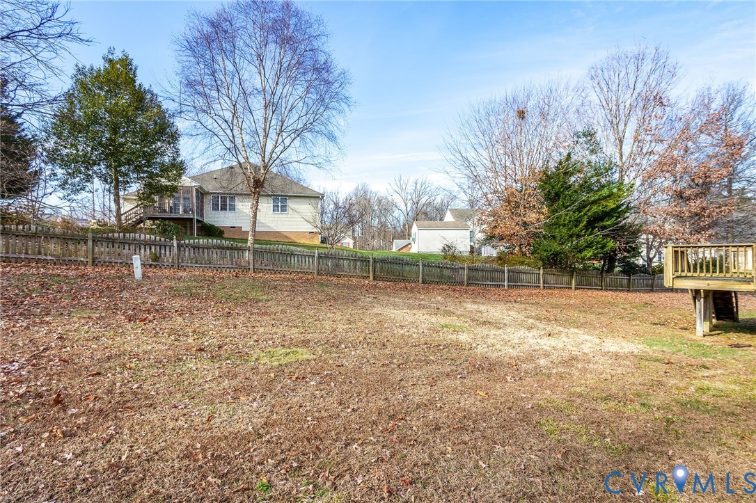 3120 Clintwood Road Midlothian, VA 23112 - Photo 27 of 38 a backyard of a house with lots of green space