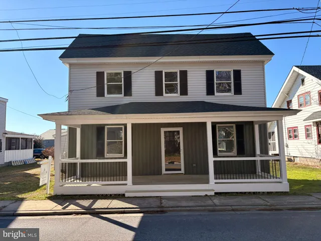 a view front of houses with deck