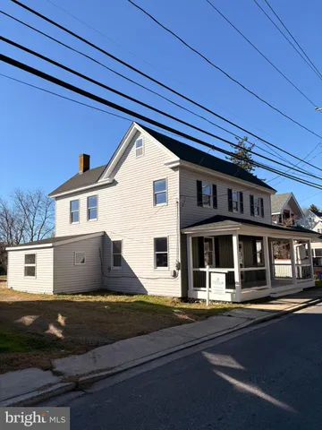 a front view of a house with a ocean view